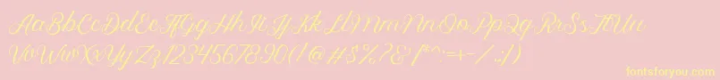 フォントRoyalite Script – 黄色のフォント、ピンクの背景