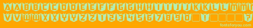フォントRubCaps Decepticon – オレンジの背景に緑のフォント