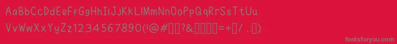 RuhmaFont-Schriftart – Graue Schriften auf rotem Hintergrund