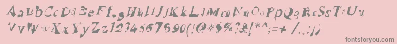 RuinedSerifIta-fontti – harmaat kirjasimet vaaleanpunaisella taustalla