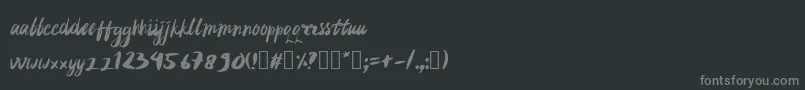 フォントrujakpetis – 黒い背景に灰色の文字