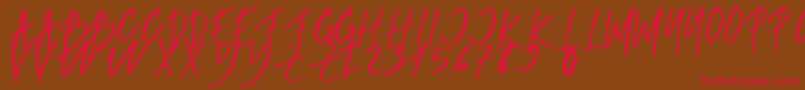 rumbe-Schriftart – Rote Schriften auf braunem Hintergrund