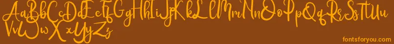Rumero-Schriftart – Orangefarbene Schriften auf braunem Hintergrund