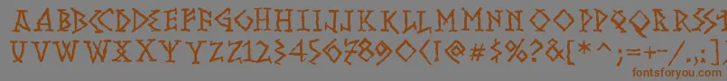 フォントRunishMK – 茶色の文字が灰色の背景にあります。
