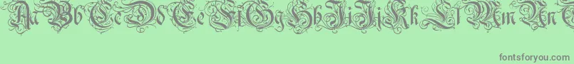 Ruritania-Schriftart – Graue Schriften auf grünem Hintergrund