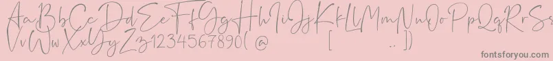 フォントRushtick – ピンクの背景に灰色の文字