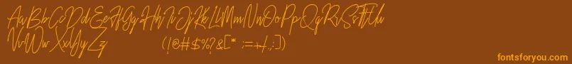 フォントRustic Towns Signature Demo – オレンジ色の文字が茶色の背景にあります。