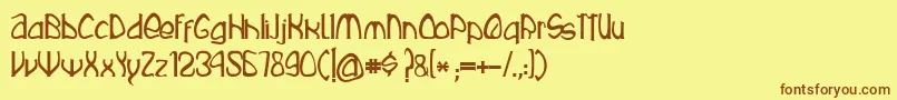 フォントRustika – 茶色の文字が黄色の背景にあります。