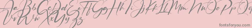 Ruthligos-Schriftart – Graue Schriften auf rosa Hintergrund