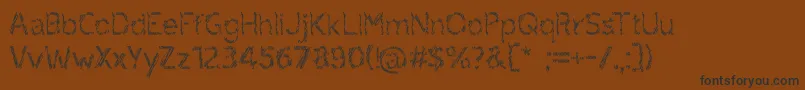 ruxandra Font – Black Fonts on Brown Background