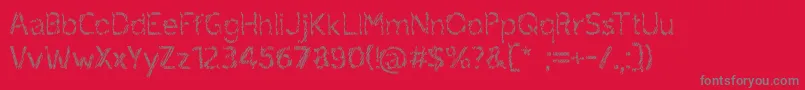 フォントruxandra – 赤い背景に灰色の文字