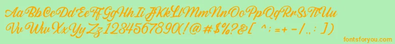 Sabatons Script DEMO-Schriftart – Orangefarbene Schriften auf grünem Hintergrund