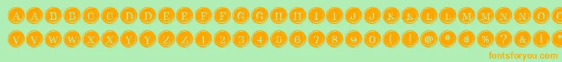 Czcionka TypeKeysFilled – pomarańczowe czcionki na zielonym tle