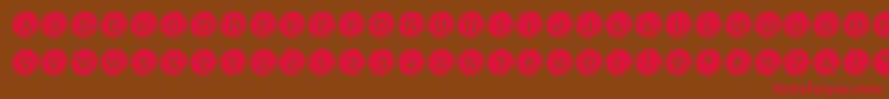 Fonte TypeKeysFilled – fontes vermelhas em um fundo marrom