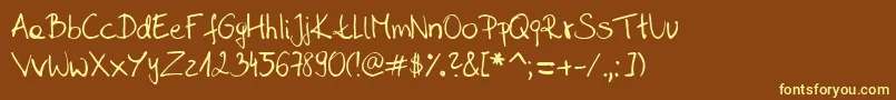 Sahara  s handwriting  D by SaharaKnoblauch Font – Yellow Fonts on Brown Background