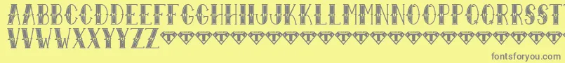 Sailor Larry   Extra Fancy-fontti – harmaat kirjasimet keltaisella taustalla