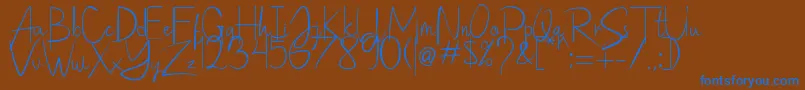 Saithik Handwritten Font – Blue Fonts on Brown Background