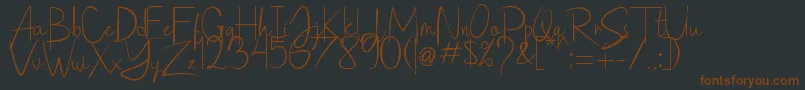 Saithik Handwritten Font – Brown Fonts on Black Background