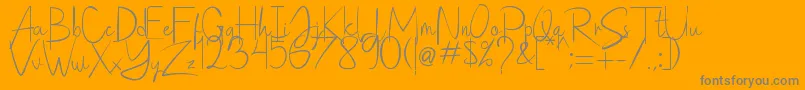 Saithik Handwritten Font – Gray Fonts on Orange Background