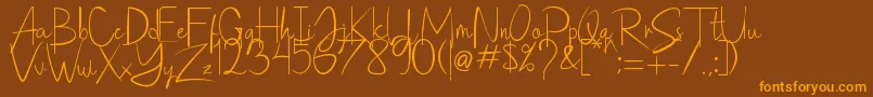 Saithik Handwritten Font – Orange Fonts on Brown Background
