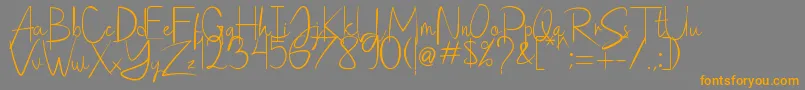 Saithik Handwritten-Schriftart – Orangefarbene Schriften auf grauem Hintergrund