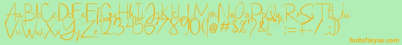 Saithik Handwritten Font – Orange Fonts on Green Background