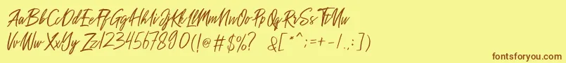 Sakoda Demo-Schriftart – Braune Schriften auf gelbem Hintergrund
