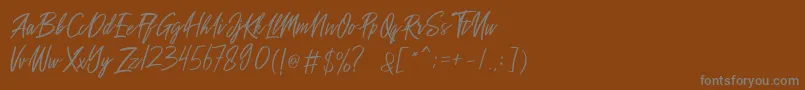 Шрифт Sakoda Demo – серые шрифты на коричневом фоне