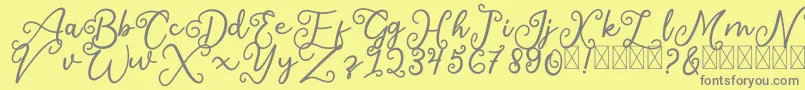 SalaheFree-fontti – harmaat kirjasimet keltaisella taustalla