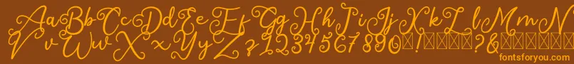 フォントSalaheFree – オレンジ色の文字が茶色の背景にあります。