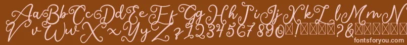 SalaheFree-fontti – vaaleanpunaiset fontit ruskealla taustalla