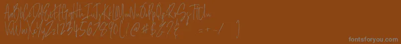 Salernitana Script Font – Gray Fonts on Brown Background