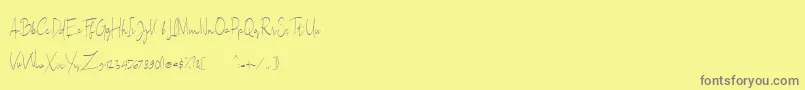 フォントSallita Free Version – 黄色の背景に灰色の文字