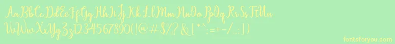 フォントSallita – 黄色の文字が緑の背景にあります