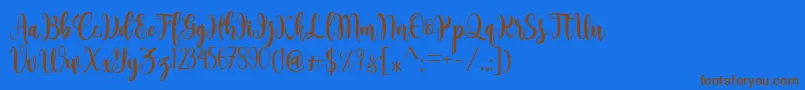 Sambilan Font – Brown Fonts on Blue Background
