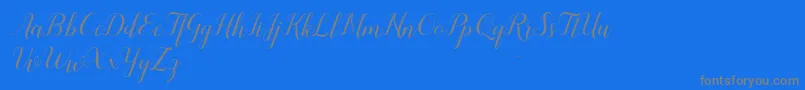 フォントSandhya – 青い背景に灰色の文字