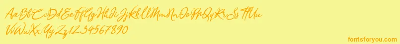 フォントSandra Belhock Italic – オレンジの文字が黄色の背景にあります。