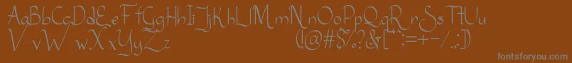 Sanggria-Schriftart – Graue Schriften auf braunem Hintergrund