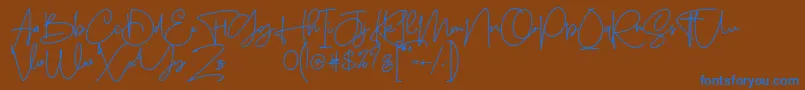 Sanpaullo-Schriftart – Blaue Schriften auf braunem Hintergrund