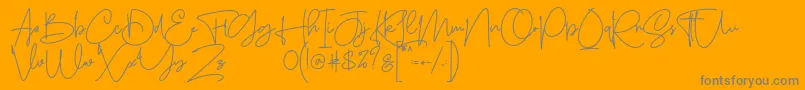 Sanpaullo-Schriftart – Graue Schriften auf orangefarbenem Hintergrund