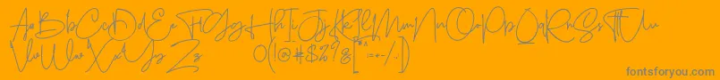 Sanpaullo-Schriftart – Graue Schriften auf orangefarbenem Hintergrund