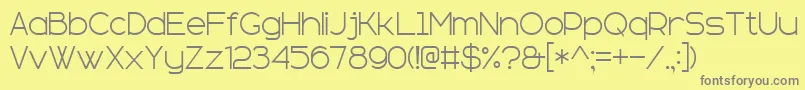sans serif plus 7-fontti – harmaat kirjasimet keltaisella taustalla