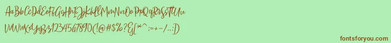 Sarmilla Script Font – Brown Fonts on Green Background