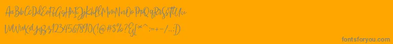 Sarmilla Script-Schriftart – Graue Schriften auf orangefarbenem Hintergrund