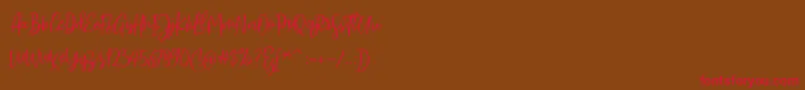 Sarmilla Script Font – Red Fonts on Brown Background