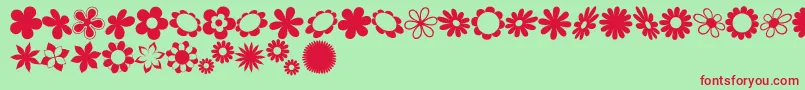 sarusFlowerDingsRB-Schriftart – Rote Schriften auf grünem Hintergrund