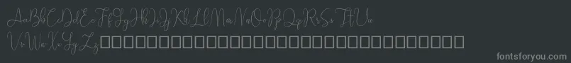 Sathien demo-fontti – harmaat kirjasimet mustalla taustalla