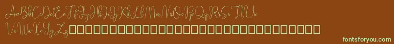 フォントSathien demo – 緑色の文字が茶色の背景にあります。