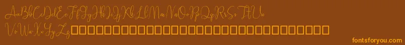 Sathien demo Font – Orange Fonts on Brown Background