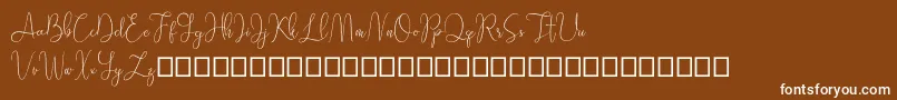 Sathien demo-fontti – valkoiset fontit ruskealla taustalla